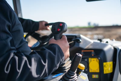 hydraulic controls on electric tractor at dairy farm