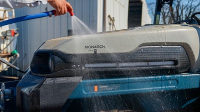 washing electric tractor at dairy farm