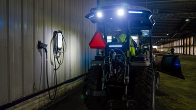 charging electric tractor at dairy farm